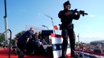 Republican presidential candidate former President Donald Trump is covered by U.S. Secret Service agents at a campaign rally, Saturday, July 13, 2024, in Butler, Pa. (AP Photo/Evan Vucci)