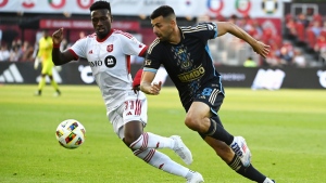 Toronto FC midfielder Derrick Etienne Jr (11) vies for possession of the ball against Philadelphia Union attacker Tai Baribo during first half MLS soccer action in Toronto on Saturday, July 13, 2024. THE CANADIAN PRESS/Jon Blacker