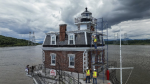 Larry Gaylord, DJ Dorbert and Chad Frederick work on the Hudson-Athens Lighthouse, Wednesday, June 12, 2024, in Hudson, N.Y.  (AP Photo/Julia Nikhinson)