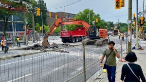 Crews are shown digging up the road at Spadina Avenue and Bloor Street on July 15. (Francis Gibbs)