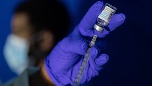 A family nurse practitioner prepares a syringe with the Mpox vaccine for inoculating a patient at a vaccination site in the Brooklyn borough of New York, on Tuesday, Aug. 30, 2022.  (AP Photo/Jeenah Moon, File)