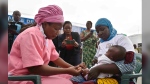A health worker administers the malaria vaccine Oxford-Serum R21 to a child in Abidjan, Ivory Coast, Monday, July 15, 2024. (AP Photo/Diomande Ble Blonde)