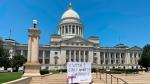 A demonstrator holds a sign protesting the U.S. Supreme Court's decision overturning Roe v. Wade outside the Arkansas Capitol, June 24, 2022, in Little Rock, Ark. (AP Photo/Andrew DeMillo, File)