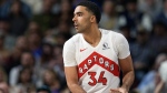 FILE - Toronto Raptors center Jontay Porter (34) looks to pass in the first half of an NBA basketball game Monday, March 11, 2024, in Denver. (AP Photo/David Zalubowski, File)