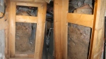 View inside of wood frame after engineers removed metal panel. 
