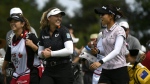 Canada's Brooke Henderson and New Zealand's Lydia Ko share a laugh as they walk on the fairway during the CP Women's Open in Ottawa on August 25, 2022. THE CANADIAN PRESS/Justin Tang