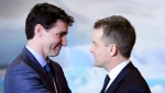 Prime Minister Justin Trudeau embraces then-Indigenous Services Minister Seamus O'Regan at a swearing in ceremony at Rideau Hall in Ottawa on Monday, Jan. 14, 2019. THE CANADIAN PRESS/Sean Kilpatrick 