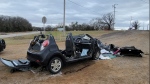FILE - In this image provided by KFOR-TV, a heavily damaged vehicle is seen off a road in Tishomingo, Okla., following a two-vehicle collision in which six teenage students were killed, March 22, 2022. The crash has the National Transportation Safety Board urging parents to warn teenagers about the risk of driving after using marijuana. (NewsNation KFOR via AP File)