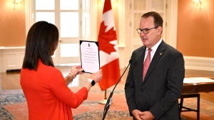 Minister of Labour and Seniors Steven MacKinnon swears the oath at a cabinet swearing-in ceremony at Rideau Hall in Ottawa, on Friday, July 19, 2024. THE CANADIAN PRESS/Justin Tang