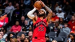 Toronto Raptors guard Gary Trent Jr. (33) shoots a 3-pointer against the Atlanta Hawks during the first half of an NBA basketball game Friday, Feb. 23, 2024, in Atlanta. (AP Photo/Jason Allen)