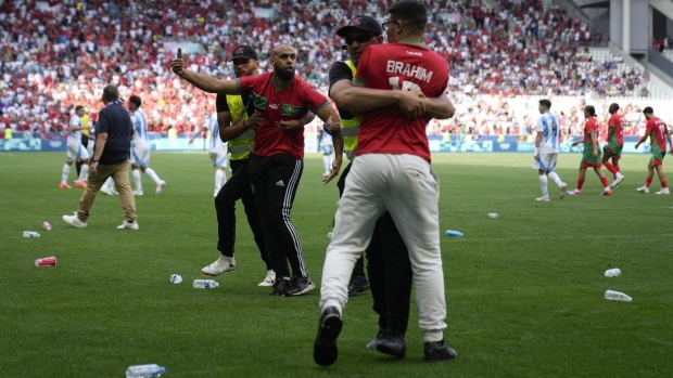 Fans rush on field