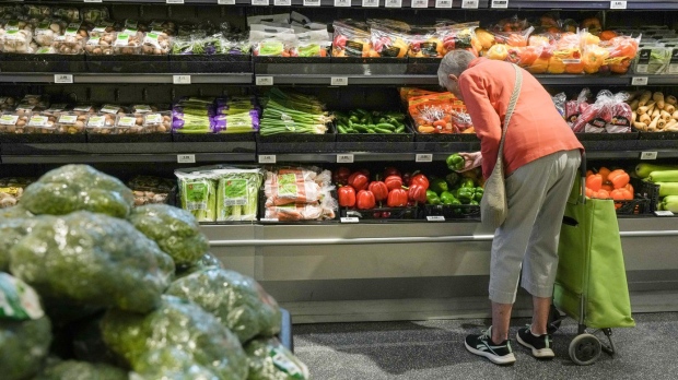 A customer shops in a new 'small format' No Frills grocery store, in Toronto, Thursday, May 30, 2024. THE CANADIAN PRESS/Chris Young
