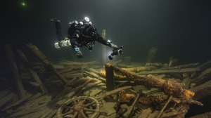 A diver from the Polish Baltictech team inspects wreckage of a 19th century sailing ship that the team discovered July 11, 2024, on the Baltic seabed about 37 kilometres (20 nautical miles) south of the Swedish isle of Öland. (Marek Cacaj/Baltictech via AP)