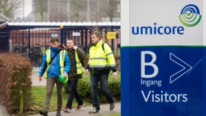 Umicore workers leave the Umicore plant in Olen, Belgium on Thursday Jan. 23, 2014. (AP Photo/Geert Vanden Wijngaert)