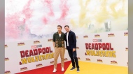 Ryan Reynolds, left, and Hugh Jackman pose for photographers at the photo call for the film 'Deadpool & Wolverine' on Friday, July 12, 2024 in London. (Photo by Vianney Le Caer/Invision/AP)