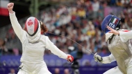 Eleanor Harvey, of Canada, celebrates her win over Martina Favaretto, of Italy, in the women's individual foil in Paris, France on Sunday, July 28, 2024. (The Canadian Press/Christinne Muschi)