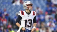 New England Patriots quarterback Nathan Rourke (13) warms up before an NFL football game against the Buffalo Bills in Orchard Park, N.Y., on December 31, 2023. THE CANADIAN PRESS/AP, Adrian Kraus