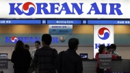 FILE - Passengers approach a Korean Air counter at Gimpo airport in Seoul, South Korea, Oct. 25, 2012. (AP Photo/Lee Jin-man, File)