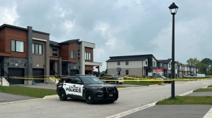 Stratford Police in the area of Bradshaw Drive and McCarthy Road West investigating a shooting that left two people dead and two others injured. (Ashley Bacon/CTV News)