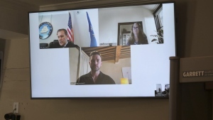 Justin Timberlake, center, appears by video during his arraignment in Sag Harbor Justice Carl Irace's courtroom on Friday, Aug. 2, 2024 in Sag Harbor, N.Y. (John Roca/Newsday via AP)