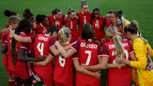 Canada players gather ahead of a women's quarterfinal soccer match between Canada and Germany at the 2024 Summer Olympics, Saturday, Aug. 3, 2024, at Marseille Stadium in Marseille, France. (AP Photo/Daniel Cole)