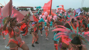 Revellers dance at the Caribbean Carnival Grand Parade in Toronto on Saturday, Aug. 3, 2024. (CP24)