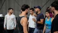 French-Algerian choreographer Mourad Merzouki guides his dancers as they rehearse for "Dance of the Games" at the concert hall in Creteil, east of Paris, Wednesday July 31, 2024. (AP Photo/Michel Euler)