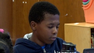 Malachi Smith meditates during a mindfulness session in his classroom at Roberta T. Smith Elementary School, May 14, 2024, in Rex, Georgia. (AP Photo/Sharon Johnson)