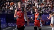 Canada's Michelle Plouffe (1) and Kacie Bosch (4) walk off the court after their women's 3 X 3 basketball semifinal loss to Germany at the Summer Olympics in Paris on Monday, Aug.5, 2024. (The Canadian Press/Adrian Wyld)