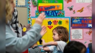 The day of the school's closure is marked on a calendar as children, including Mariah Wallen, 5, march in a circle to music in the Stars classroom at the Meadow Lakes CCS Early Learning, a Head Start center, Monday, May 6, 2024, in Wasilla, Alaska. (AP Photo/Lindsey Wasson)