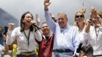 Opposition leader Maria Corina Machado, left, and opposition presidential candidate Edmundo Gonzalez address supporters during a protest against the official presidential election results in Caracas, Venezuela, on Tuesday, July 30, 2024, two days after the vote. (AP Photo/Cristian Hernandez)