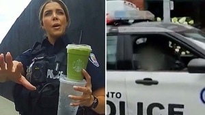 Toronto Police are investigating after a video surfaced that appears to show an officer giving the finger to a man who questioned her about parking illegally to get coffee.  