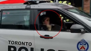 Officer appears to give middle finger
