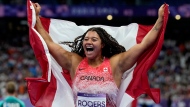 Canada's Camryn Rogers celebrates her gold medal won in the women's hammer throw event at the Summer Olympics in Paris, Tuesday, Aug. 6, 2024. THE CANADIAN PRESS/Adrian Wyld