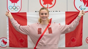 Canadian Olympic Swimmer Summer McIntosh poses for a photograph after arriving at Toronto Pearson International Airport in Mississauga, Ont., Tuesday, Aug. 6, 2024. THE CANADIAN PRESS/Arlyn McAdorey