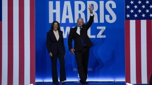 Democratic presidential nominee Vice President Kamala Harris and her running mate Minnesota Gov. Tim Walz arrive at a campaign rally in Philadelphia, Tuesday, Aug. 6, 2024. (AP Photo/Matt Rourke)