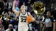 Iowa guard Caitlin Clark (22) celebrates after defeating LSU in an Elite Eight round college basketball game during the NCAA Tournament, Monday, April 1, 2024, in Albany, N.Y. (AP Photo/Mary Altaffer, File)