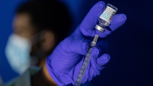 A family nurse practitioner prepares a syringe with the mpox vaccine for inoculating a patient at a vaccination site in the Brooklyn borough of New York, on Tuesday, Aug. 30, 2022. (Jeenah Moon / AP Photo, File)