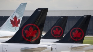 Air Canada logos are seen on the tails of planes at the airport in Montreal on Monday, June 26, 2023.THE CANADIAN PRESS/Adrian Wyld