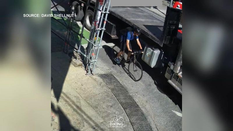 A cyclist is shown moments prior to colliding with a turning truck near Bloor and Dufferin streets on July 25. (Submitted/David Shellnutt)