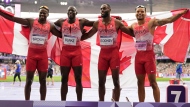 Team Canada pose after winning the gold medal in the men's 4 x 100 meters relay final at the 2024 Summer Olympics, Friday, Aug. 9, 2024, in Saint-Denis, France. (AP Photo/Ashley Landis)