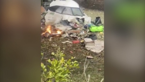 This frame grab from video shows wreckage from a plane that crashed by a home in Vinhedo, Sao Paulo state, Brazil, Friday, Aug. 9, 2024. (Felipe Magalhaes Filho via AP)