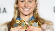 Canada's Summer McIntosh of Toronto poses with her four medals won in the pool at the 2024 Summer Olympics, Monday, Aug. 5, 2024 in Paris, France. The three gold medals were for the 200m Butterfly, the 200m Individual Medley and the 400m Individual Medley and the one silver was for the 400m Freestyle. THE CANADIAN PRESS/Christinne Muschi