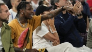 Travis Scott watches the France vs' Germany game during a men's semifinals basketball game at Bercy Arena at the 2024 Summer Olympics, Thursday, Aug. 8, 2024, in Paris, France. (AP Photo/Mark J. Terrill)