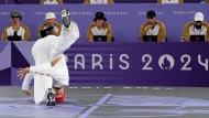 Canada's Philip "Phil Wizard" Kim, of Vancouver, B.C., competes against Netherlands' Lee-Lou Diouf Demierre, not shown, in the breaking quarterfinal event during the Summer Olympics in Paris, Saturday, Aug. 10, 2024. THE CANADIAN PRESS/Christinne Muschi
