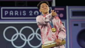 Canada's Philip "Phil Wizard" Kim, of Vancouver, B.C., reacts after the breaking final during the Summer Olympics in Paris, Saturday, Aug. 10, 2024. Kim took gold in the first Olympic men's breaking tournament Saturday. THE CANADIAN PRESS/Christinne Muschi