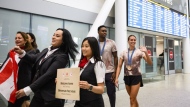 Olympic medalists Joshua Liendo and Kylie Masse greet fans after arriving at Pearson airport following the Paris 2024 Olympic Games, in Toronto, Monday, Aug. 12, 2024. THE CANADIAN PRESS/Christopher Katsarov