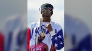 US artist Snoop Dogg gestures during the men's skateboarding park finals at the 2024 Summer Olympics, Wednesday, Aug. 7, 2024, in Paris, France. (AP Photo/Frank Franklin II)