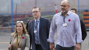 Freedom Convoy organizers Tamara Lich and Chris Barber (right) make their way with counsel to the Public Order Emergency Commission, November 1, 2022 in Ottawa. THE CANADIAN PRESS/Adrian Wyld
