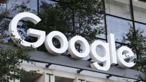 A Google sign hangs over an entrance to the company's new building, Sept. 6, 2023, in New York. (AP Photo/Peter Morgan, File)